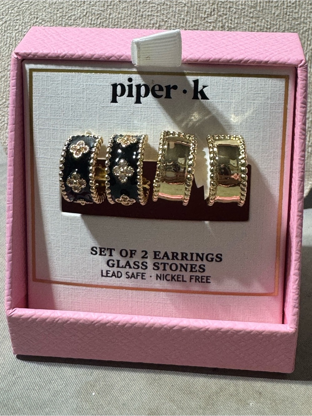 2 pairs Piper K huggie hoop earrings black clover design & gold finishes. NWT